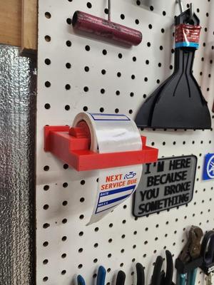 Oil reminder dispenser pegboard