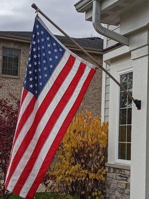 Exterior wall flagpole mount