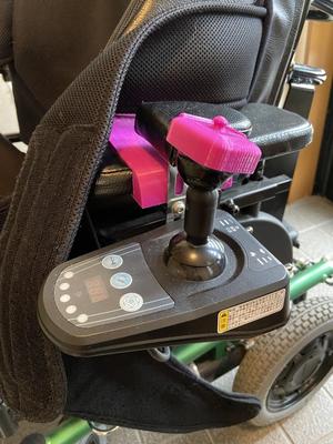  Joystick attachment and armrest cover for electric wheelchairs