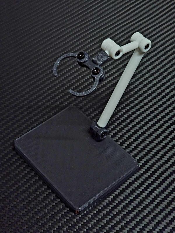 Base with articulated arm for 6¨ figures.