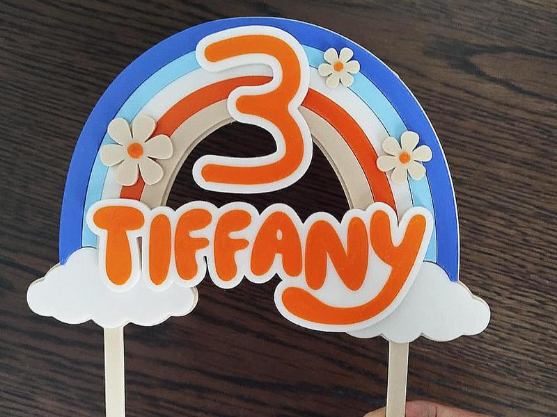 Cake topper with rainbow and flowers