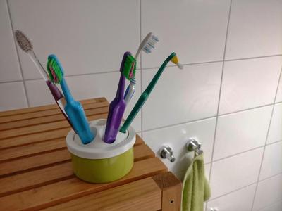 Toothbrush holder made out of a recycled tuna can