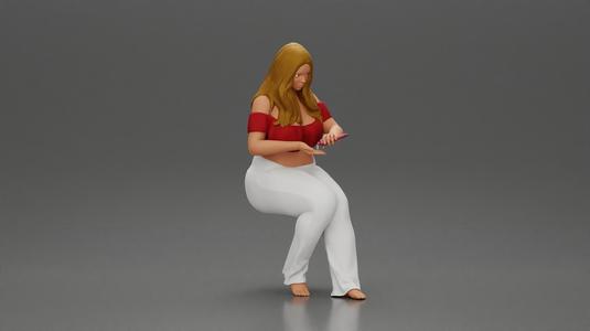 Blonde woman in red top white pants sitting applies hand cream
