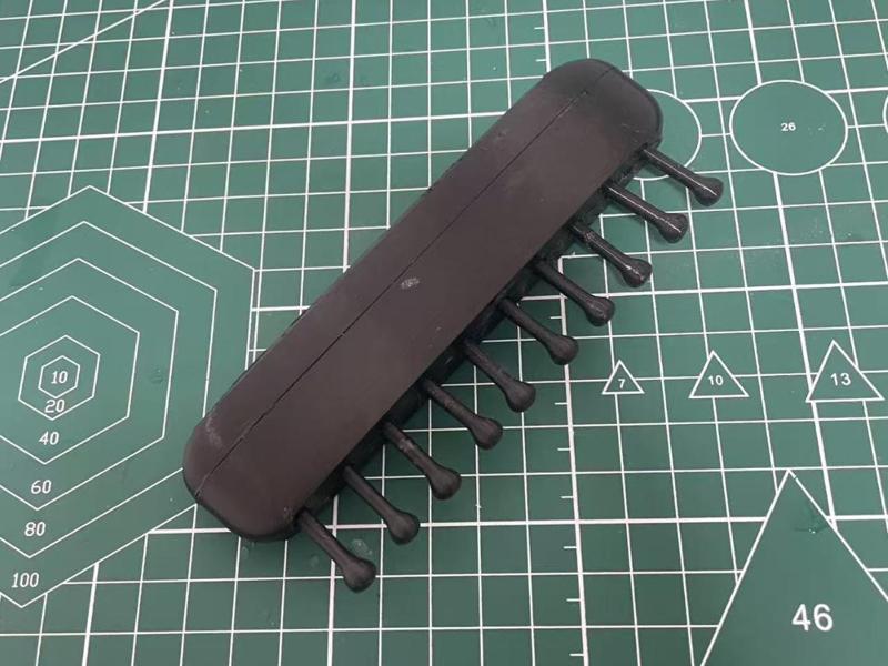 Pressable massage comb