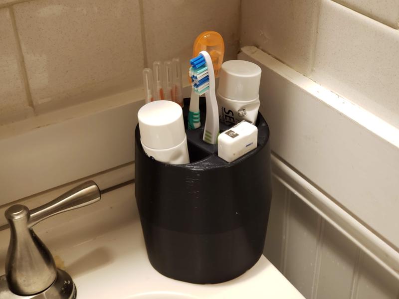 Toothbrush/paste holder