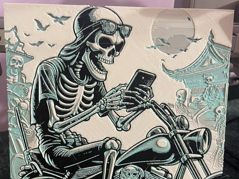 A Skeleton with Mobile on Motorcycle - A1 mini