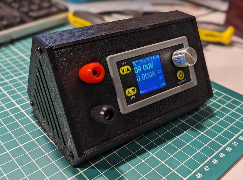 DC-DC regulated laboratory power supply and meter