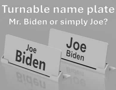 Turnable name plate