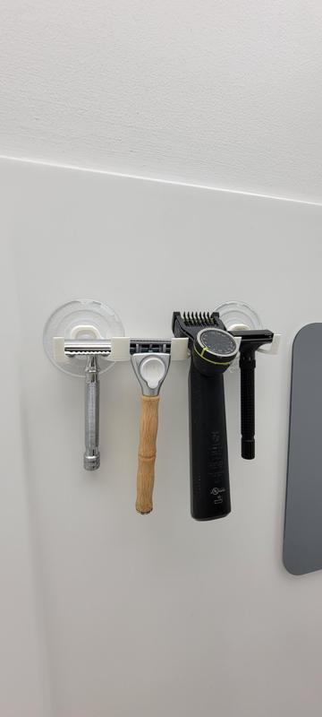 Shower razor blade hanger