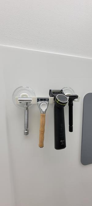 Shower razor blade hanger