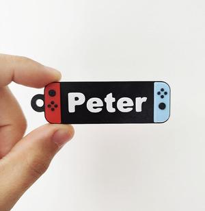 Gaming console keychain with name Peter