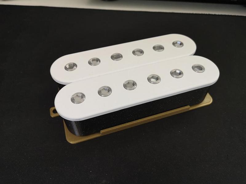 Guitar humbucker style storage box