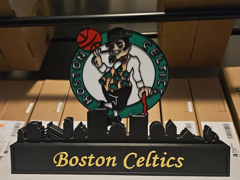 Boston Celtics with the skyline of Boston NBA