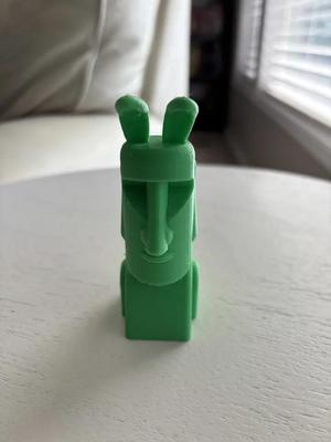 Easter Island statue with bunny ears   