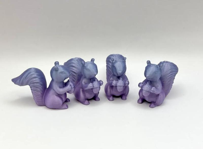 Tiny Squirrel holding Nut   