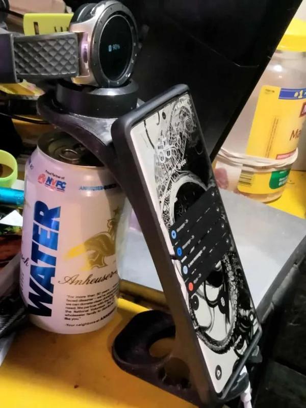 simple phone and watch holder that allows (cable) charging   