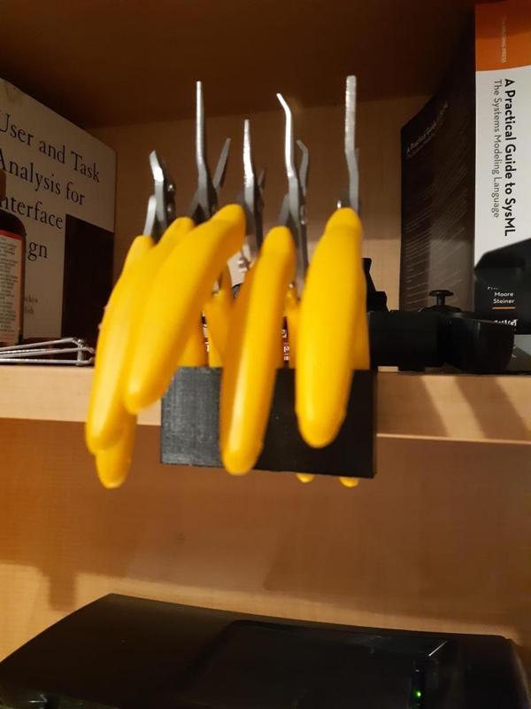 Plier hanger for 25mm wood shelving