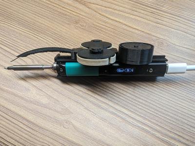 UniSolder: One-handed soldering with just rubber bands