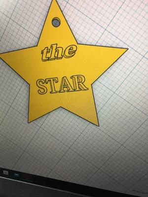 star keychain with the inscription the star