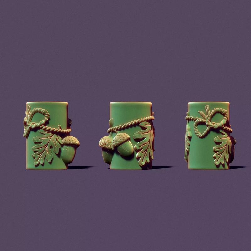 Autumn candle with acorns and leaves