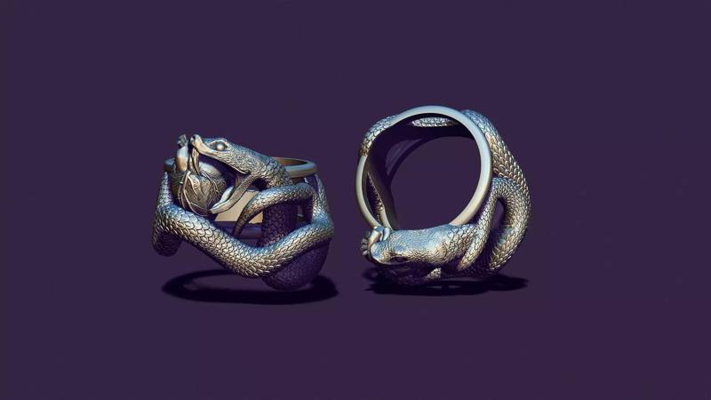 The silver ring is a snake biting the heart