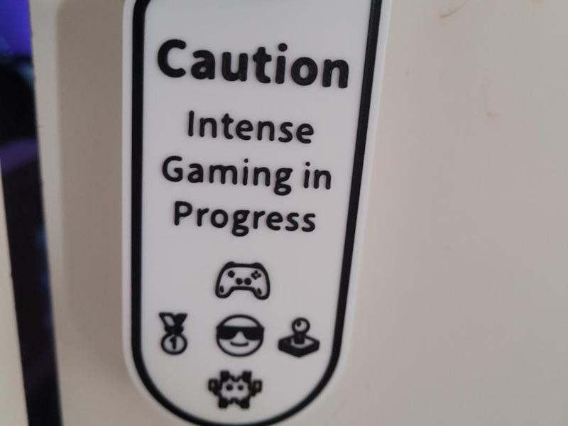 cuation intense gaming in progress sign