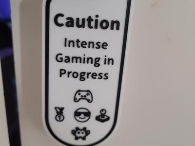 cuation intense gaming in progress sign