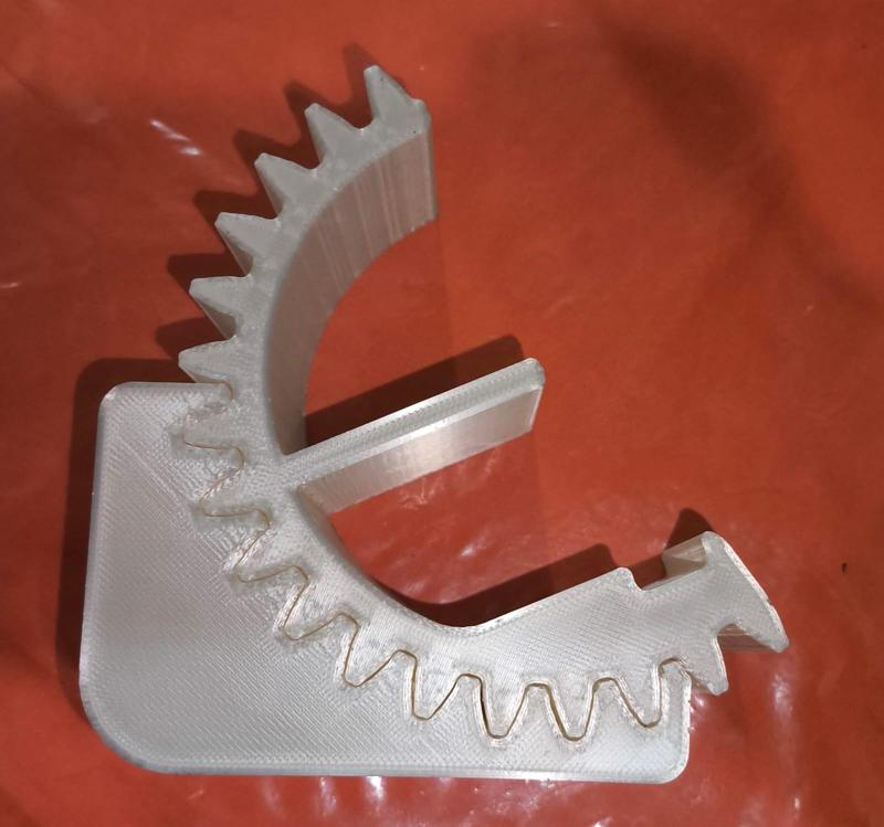 CELL PHONE BASE IN THE SHAPE OF A GEAR