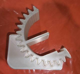 CELL PHONE BASE IN THE SHAPE OF A GEAR