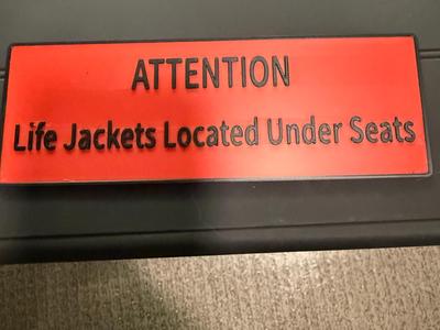 Life Jacket under seat sign