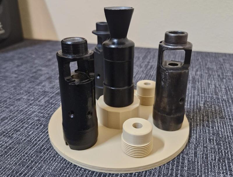 AK74 and 10X muzzle brakes display